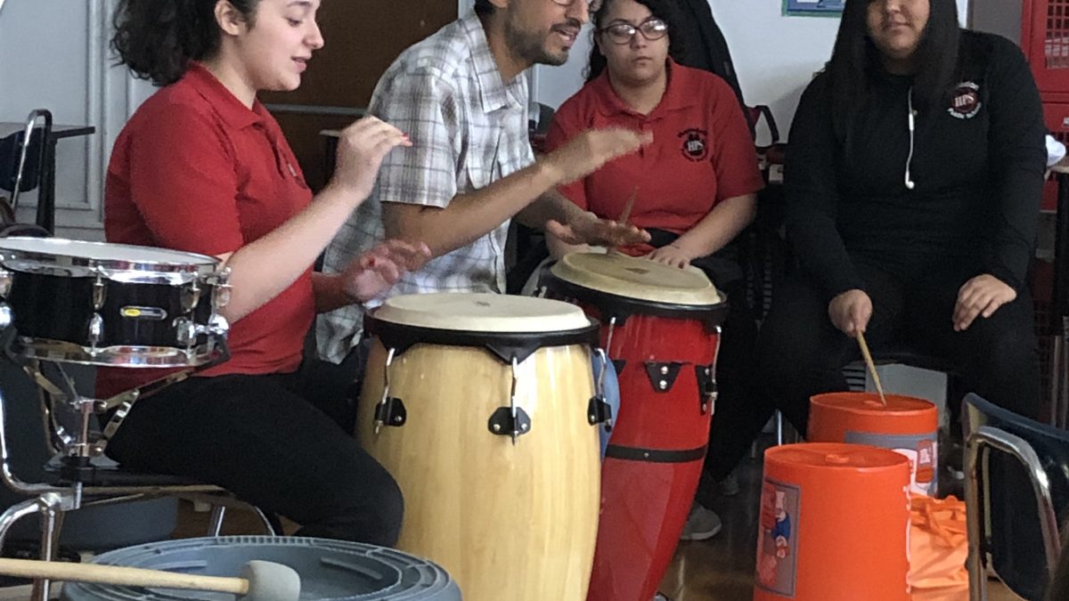 Students at The Haledon School practice with musician Hector Morales.