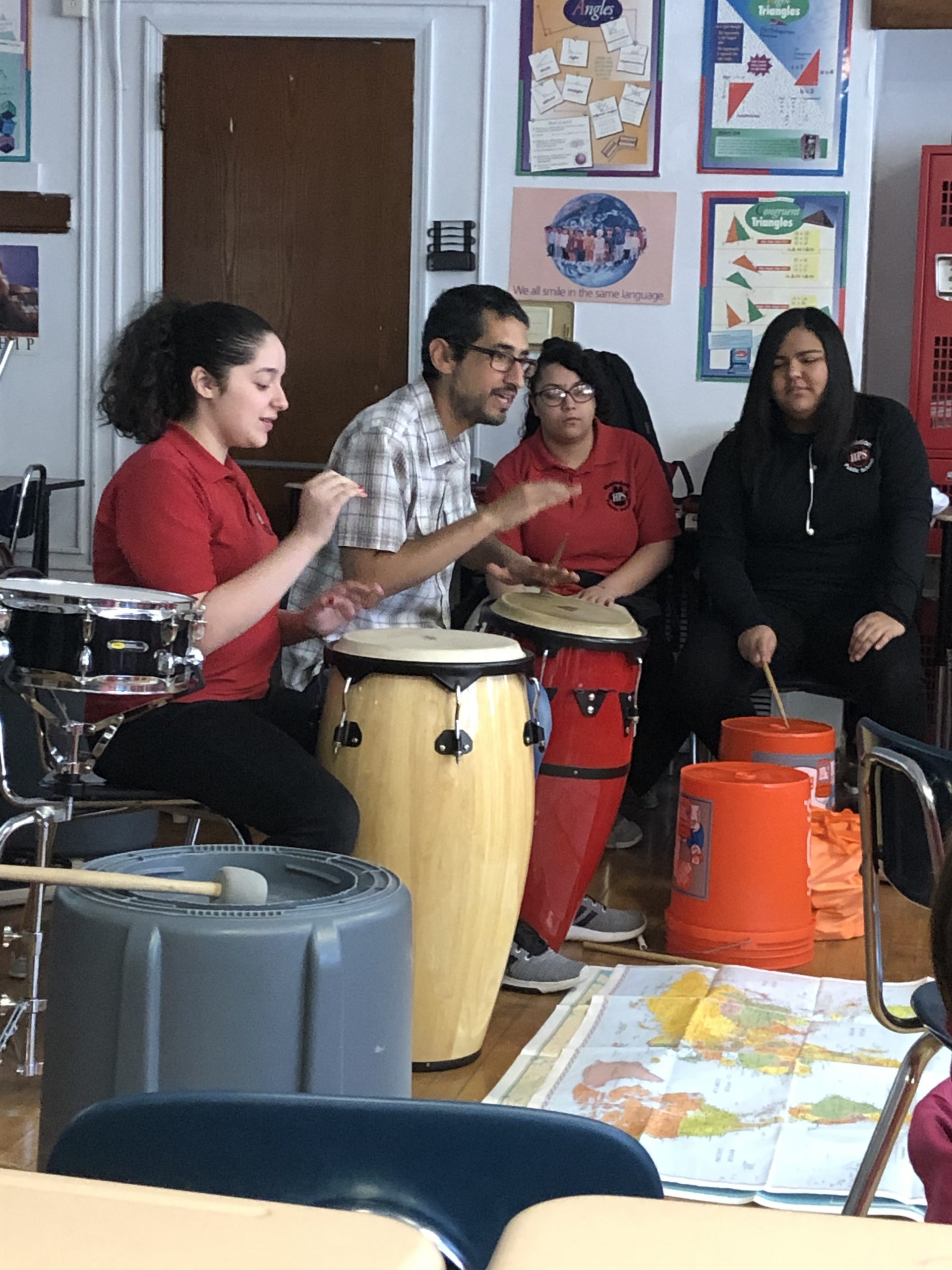 Students at The Haledon School practice with musician Hector Morales.